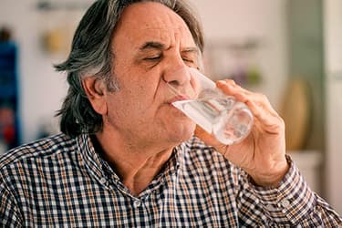 493ss_thinkstock_rf_mature_man_drinking_water.jpg?resize=375px:250px&output-quality=50