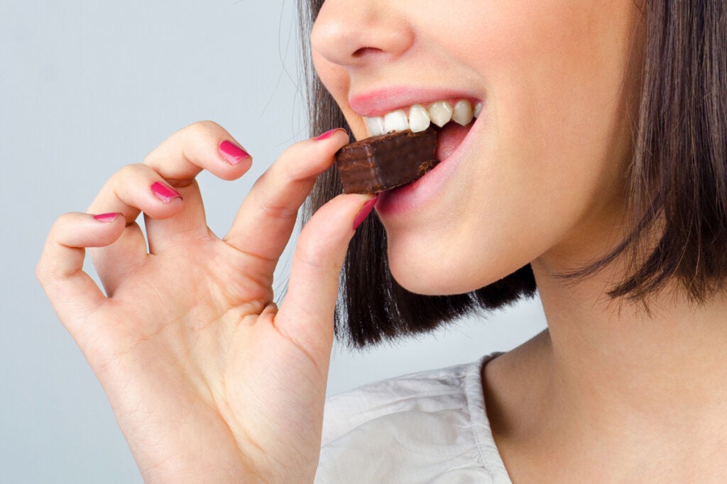Woman eating chocolate