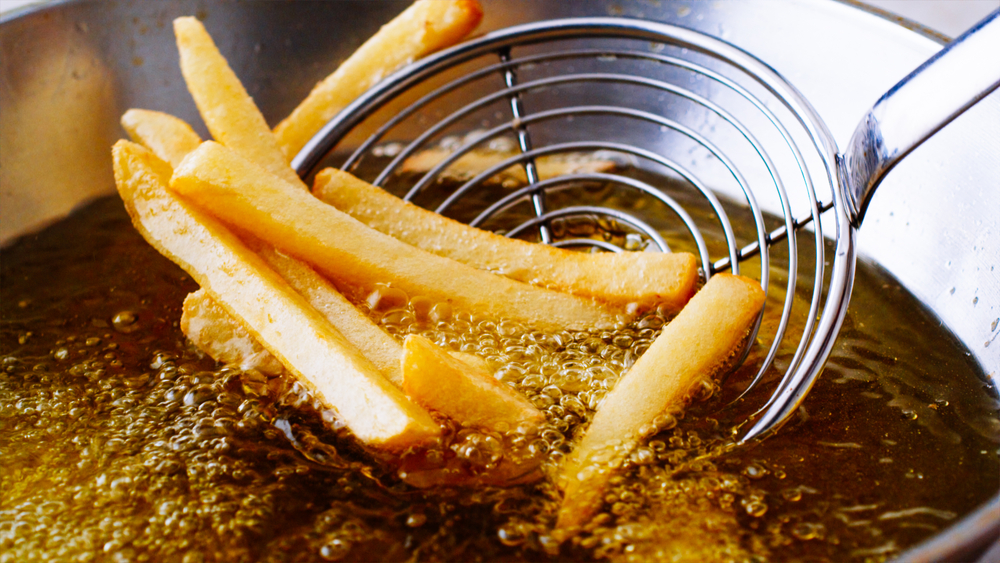 Pulling fries out of hot oil